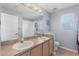 Traditional bathroom features a double vanity with sinks at 546 Windsor Pl, Davenport, FL 33896