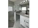 Beautiful bathroom featuring granite countertops, walk-in shower, and tub at 546 Windsor Pl, Davenport, FL 33896