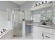 The bathroom is equipped with a shower, tub, and double vanity at 546 Windsor Pl, Davenport, FL 33896