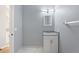 Bathroom with marble floors, a granite vanity, and a decorative mirror at 546 Windsor Pl, Davenport, FL 33896