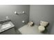 Bathroom featuring a bidet, granite countertop vanity, and tile flooring at 546 Windsor Pl, Davenport, FL 33896