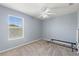 Bedroom with a window and neutral carpeting at 546 Windsor Pl, Davenport, FL 33896