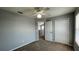 This bedroom has carpet floors, ceiling fan, and closet for storage at 546 Windsor Pl, Davenport, FL 33896