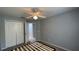 This bedroom features carpet floors, neutral walls, and a ceiling fan at 546 Windsor Pl, Davenport, FL 33896
