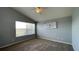 Cozy bedroom with vaulted ceiling, neutral carpeting, and a large window at 546 Windsor Pl, Davenport, FL 33896