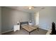 Simple bedroom with neutral paint, a ceiling fan, and carpeted floors at 546 Windsor Pl, Davenport, FL 33896