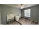 This bedroom features carpet floors, ceiling fan, and plenty of space at 546 Windsor Pl, Davenport, FL 33896