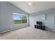 Neutral bedroom with a large window offering outdoor views at 546 Windsor Pl, Davenport, FL 33896