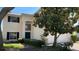 Beautiful two-story home featuring a lush front yard and a welcoming entrance at 546 Windsor Pl, Davenport, FL 33896