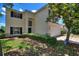 Charming two-story home with an attached garage, manicured lawn, and beautiful exterior features at 546 Windsor Pl, Davenport, FL 33896