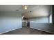 Neutral hallway features new carpet, a fan light, and an outlet at 546 Windsor Pl, Davenport, FL 33896