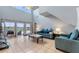 Bright living room with neutral paint, tile flooring, high ceilings, and access to the pool area at 546 Windsor Pl, Davenport, FL 33896