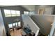 Bright living room boasts soaring ceilings and backyard pool views at 546 Windsor Pl, Davenport, FL 33896