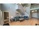 Living room showcases tile floors, soaring ceilings and a staircase at 546 Windsor Pl, Davenport, FL 33896