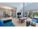 Open-concept living room with tile flooring, high ceilings, and neutral paint throughout at 546 Windsor Pl, Davenport, FL 33896