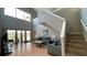 Spacious living room showcases a staircase, tile floors and backyard access at 546 Windsor Pl, Davenport, FL 33896