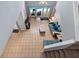 Open living room with tile flooring, high ceilings, and views of the pool at 546 Windsor Pl, Davenport, FL 33896