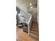 Bright living room with high ceiling, staircase, and comfortable seating at 546 Windsor Pl, Davenport, FL 33896