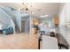 Open-concept living space with tile flooring, dining area and updated kitchen at 546 Windsor Pl, Davenport, FL 33896
