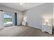 Bright main bedroom boasts access to a screened lanai with a pool view at 546 Windsor Pl, Davenport, FL 33896