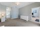 Carpeted main bedroom provides a calm and relaxing space for homeowners at 546 Windsor Pl, Davenport, FL 33896