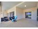 Relaxing covered patio area with comfortable seating and views of the surrounding landscape at 546 Windsor Pl, Davenport, FL 33896