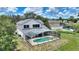 Backyard featuring a screened-in pool and patio area at 546 Windsor Pl, Davenport, FL 33896