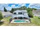 Aerial view showcasing a backyard with a screened-in pool, perfect for outdoor relaxation at 546 Windsor Pl, Davenport, FL 33896
