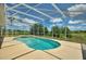 Stunning screened-in pool and spa area with a large deck, perfect for entertaining and enjoying the outdoors at 546 Windsor Pl, Davenport, FL 33896
