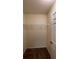Walk-in closet features a shelf and carpet flooring, offering ample storage space at 546 Windsor Pl, Davenport, FL 33896