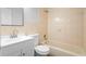 Standard bathroom with tiled walls, vanity, toilet and a bathtub at 5815 Holmes Dr, Orlando, FL 32808