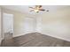 Bedroom features new floors, ceiling fan, and access to en-suite bathroom at 5815 Holmes Dr, Orlando, FL 32808