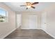 Bedroom features closet, ceiling fan, fresh paint and new floors at 5815 Holmes Dr, Orlando, FL 32808