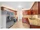 Spacious kitchen featuring updated cabinets, granite countertops, and stainless steel appliances at 5815 Holmes Dr, Orlando, FL 32808