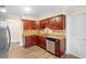 Close up of kitchen featuring updated cabinets, granite countertops, and stainless steel appliances at 5815 Holmes Dr, Orlando, FL 32808