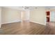 Open floor plan showcasing a spacious living area connecting to a kitchen and hallway at 5815 Holmes Dr, Orlando, FL 32808