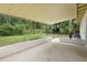 Spacious covered patio offers outdoor living space overlooking the lush backyard at 5815 Holmes Dr, Orlando, FL 32808