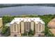 Beautiful condo with balconies and stunning lake views, complemented by lush landscaping at 6336 Buford St # 207, Orlando, FL 32835