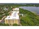 Aerial view of a condo building showcasing its proximity to natural landscapes and water views at 6336 Buford St # 207, Orlando, FL 32835