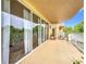 Large balcony with glass doors offering beautiful views and easy access to the outdoors at 6336 Buford St # 207, Orlando, FL 32835