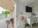 Private balcony featuring comfortable seating, plants, and access from the living area at 6336 Buford St # 207, Orlando, FL 32835