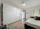 Bedroom featuring wide closet, door to ensuite, and comfortable decor at 6336 Buford St # 207, Orlando, FL 32835