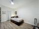 Bedroom featuring a bed and minimal decor; ideal for a guest room at 6336 Buford St # 207, Orlando, FL 32835