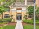 Inviting building entrance with lush landscaping and well-maintained walkway at 6336 Buford St # 207, Orlando, FL 32835