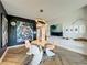 Stylish dining area with modern art, round table, and eye-catching lighting at 6336 Buford St # 207, Orlando, FL 32835
