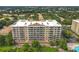 Aerial view of a large condominium complex with multiple balconies and lush landscaping at 6336 Buford St # 207, Orlando, FL 32835