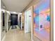 Stylish hallway features a bold, dark door and patterned decor, with mirrors and multiple rooms at 6336 Buford St # 207, Orlando, FL 32835