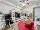 Relaxing living room with modern furniture, pink round carpet, work station, and natural light at 6336 Buford St # 207, Orlando, FL 32835
