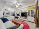 Cozy living room with a modern entertainment center, colorful accents, and a unique round rug at 6336 Buford St # 207, Orlando, FL 32835
