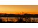 Scenic sunset view overlooking the water and trees near the property, creating a serene atmosphere at 6336 Buford St # 207, Orlando, FL 32835